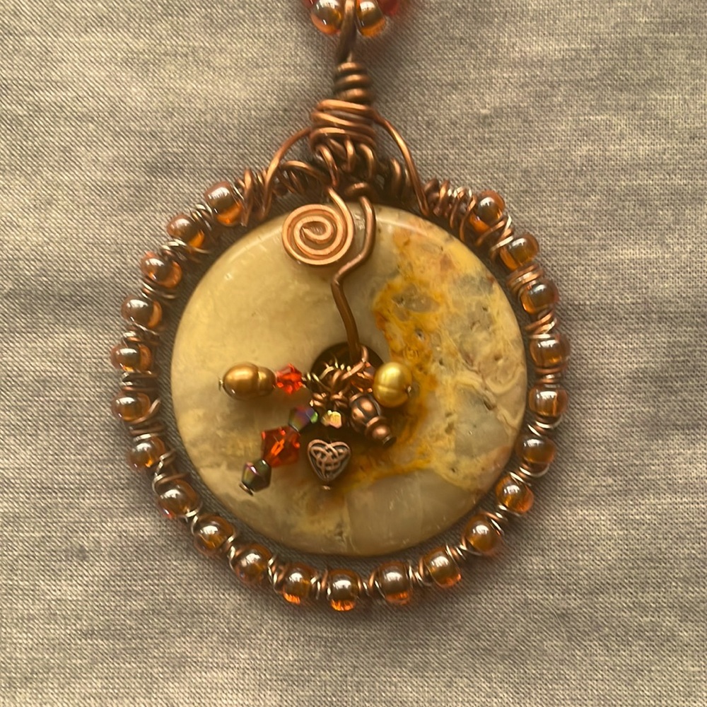 Beautiful handmade necklace with flat disc of Tiger’s Eye - chain length 33”.